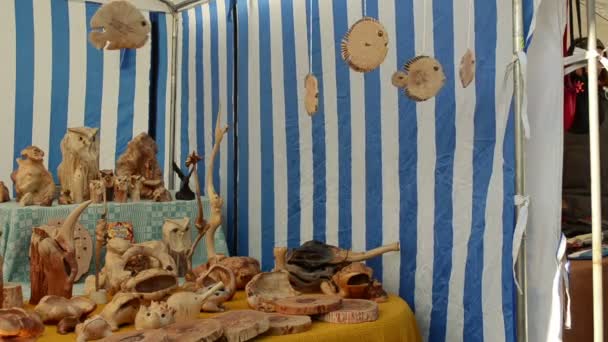 wooden hand made decorations sold outdoor street market fair - Footage, Video