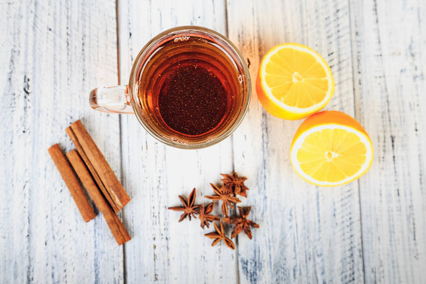 hot tea, cinnamon sticks, star anise and orange - 写真・画像