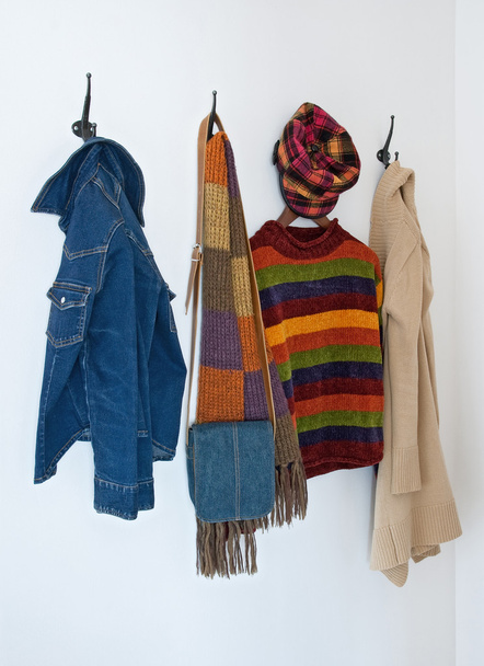 Colorful clothing on coat hooks - Photo, Image