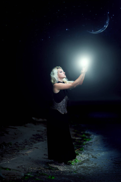 girl sorceress holds light - Photo, Image
