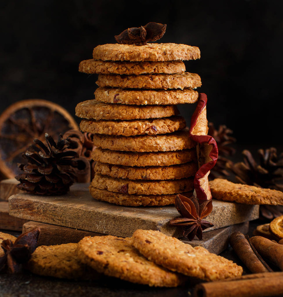 Homemade oatmeal cookies with spices and pine cones - Photo, image