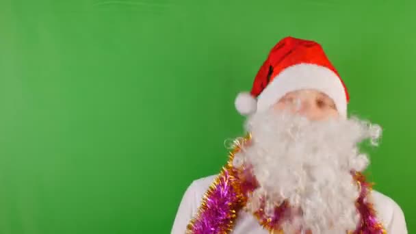 Crazy Man wearing Santa Clauss hat with white beard, New year 2019 and christmas, on green Chroma key - Metraje, vídeo