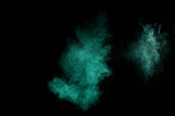 Aquamarine powder explosion on black background. Colored powder cloud. Colorful dust explode. Paint  Holi. - Foto, Bild