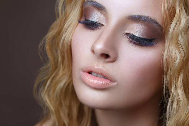 Beauty portrait of an elegant blond girl with evening make-up. - Photo, image