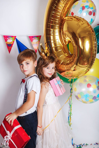 Funny happy girl and little boy celebrating birthday party, - Fotoğraf, Görsel
