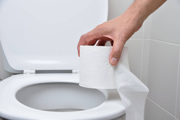 close-up of a man hand using toilet paper - Fotografie, Obrázek