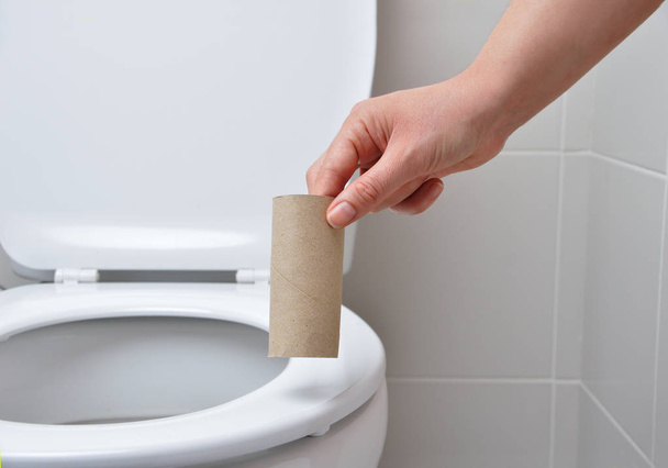 close-up of a woman hand using toilet paper - Фото, изображение
