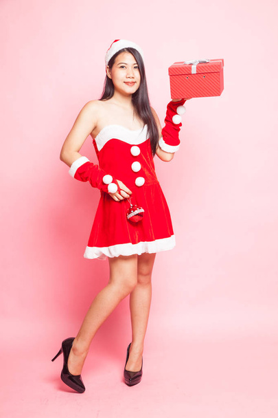 Cute Asian Christmas Santa Claus girl on pink background - Foto, Imagem