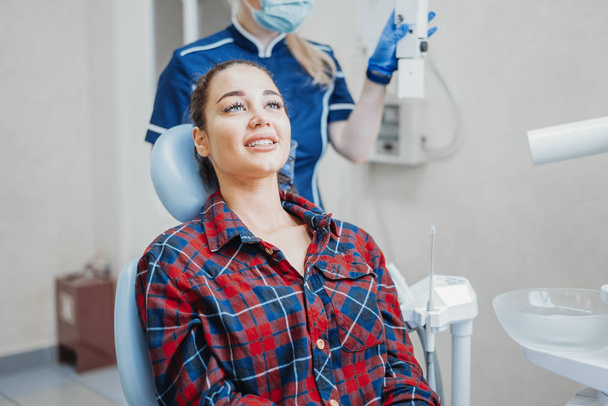 Close up of client smiling while waiting dental check up. - 写真・画像