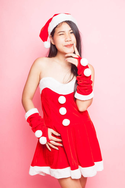 Cute Asian Christmas Santa Claus girl on pink background - Photo, image
