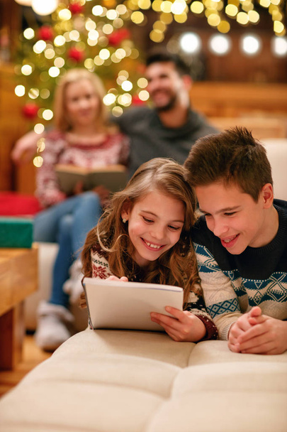 smiling brother and sister   lying and writes letter to Santa Claus for Christmas - Fotoğraf, Görsel
