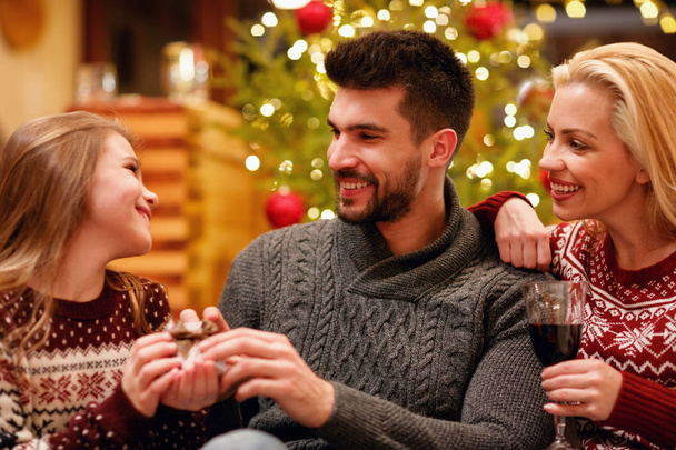 young smiling family celebrating and exchanging gifts Christmas at home - Φωτογραφία, εικόνα