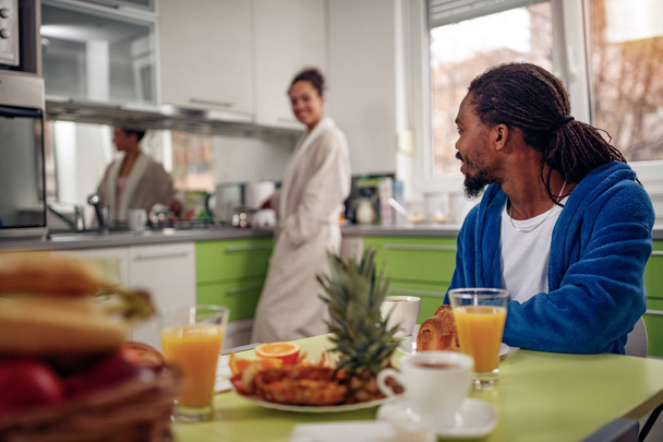 Young Afro American couple in kitchen breakfast - Valokuva, kuva