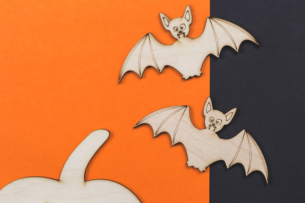 Do it yourself Halloween pumpkin and vampire bats cut outs on a colorful background in flat lay with paint and brush - Photo, Image