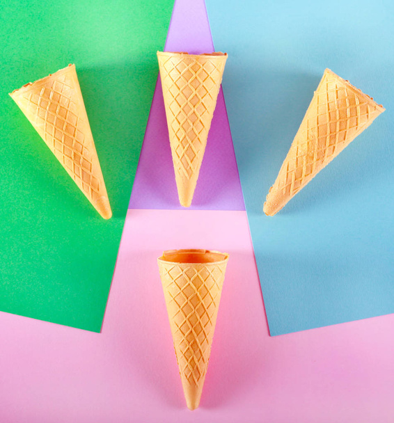 Ice cream cones over multi color background - Фото, изображение