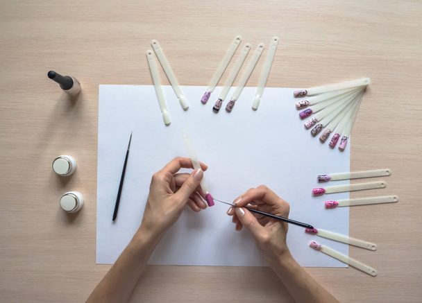 The process of creating a drawing on tips. Nail art design.  - Valokuva, kuva