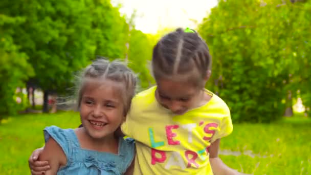 Adorable little girls laughting - Materiał filmowy, wideo