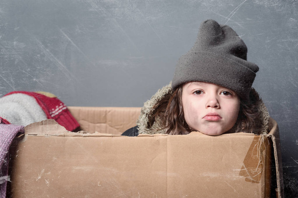 Kid, box and old clothes - Photo, image