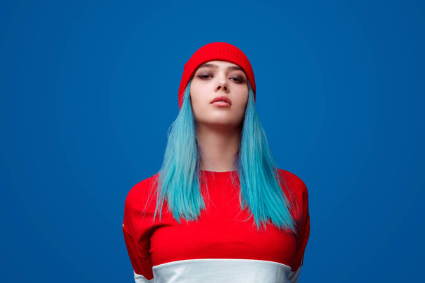 Modern confident woman with blue hair - Фото, изображение