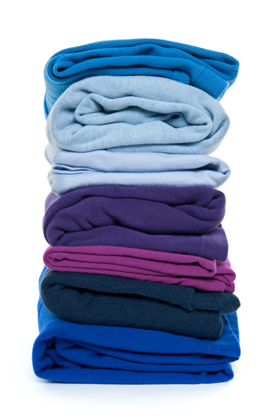 Pile of blue and purple folded clothes - Photo, Image