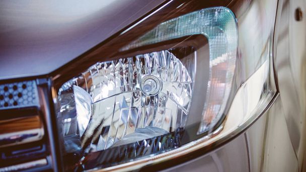 closeup view at modern car headlight. - Фото, изображение