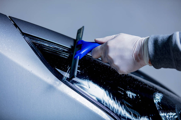 man hand washing a car headlight on carwash - Photo, Image
