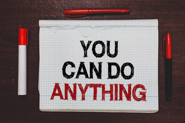 Handwriting text writing You Can Do Anything. Concept meaning Motivation for doing something Believe in yourself Written black, red words notepad on brown stage white highlighter red pens. - Foto, Imagem