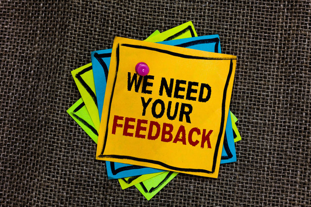 Text sign showing We Need Your Feedback. Conceptual photo Give us your review thoughts comments what to improve Black bordered different color sticky note stick together with pin on jute sack. - Photo, Image