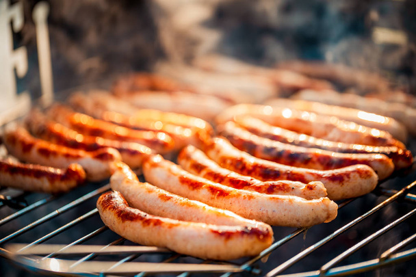 BBQ with fiery sausages on the grill - Foto, Imagem