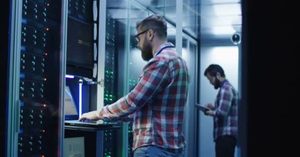 Coworking men in modern server room of data center - Footage, Video