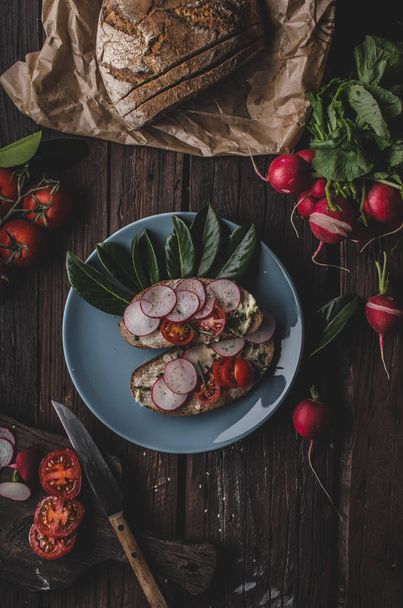 Homemade bread with fresh creame, herbs and radishes, organic food - Фото, изображение