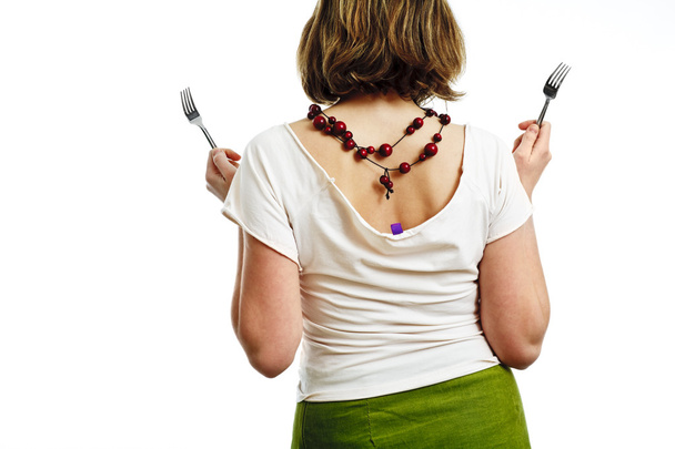 Woman with forks - back - 写真・画像