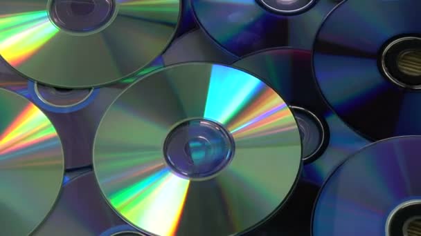 Rotierende bunte glänzende viele DVD- und CD-Compact-Discs Hintergrund - Filmmaterial, Video