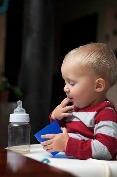 baby boy playing with bottle and mug indoor - Photo, Image