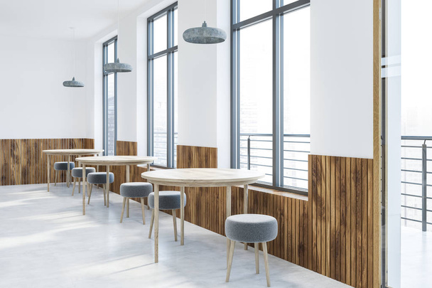 Corner of modern cafe with white and wooden walls, gray floor, round wooden tables and small round chairs along the window. 3d rendering - Foto, Imagen