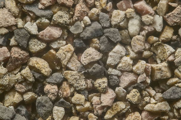 Very high definition texture of colored pebbles set in a wall. - Foto, imagen