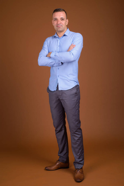 Full length shot of businessman wearing blue shirt - Photo, Image