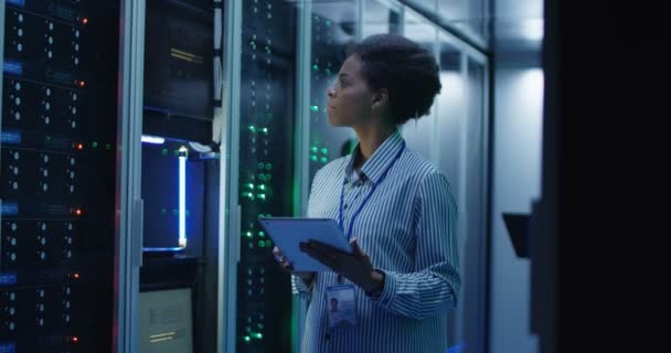 Smiling ethnic woman in data center - Footage, Video