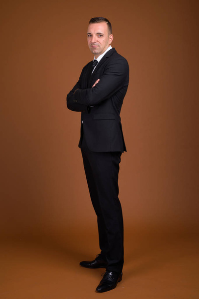 Full length shot of businessman standing and wearing suit - Photo, Image