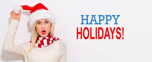 Happy holidays message with woman with Santa hat - Zdjęcie, obraz