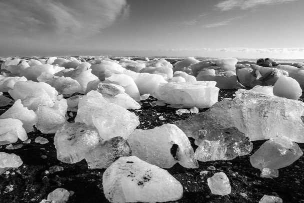Diamond Beach Iceland. Ice on the black beach near Jokulsarlon glacier lagoon. Glacier icebergs in Iceland. Icelandic Nature. - Photo, Image