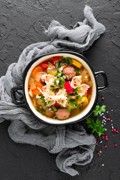 Italian minestrone soup with beef meatballs, vegetables and pasta in bowl - Foto, Bild