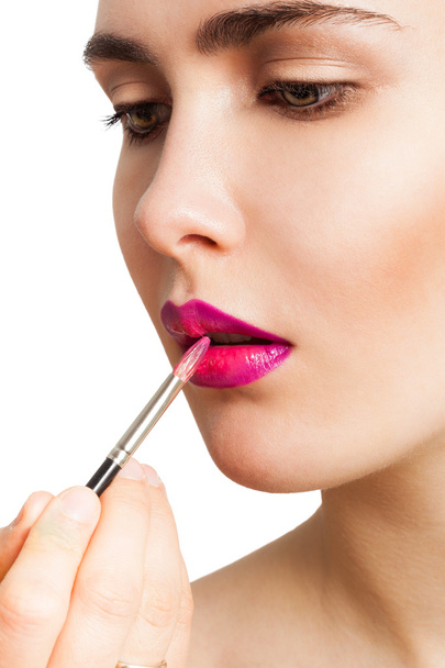 Applying lipstick brush - Foto, imagen