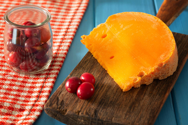 Mimolette,  type of cheese together with the addition of bread and fresh cranberries - Photo, Image