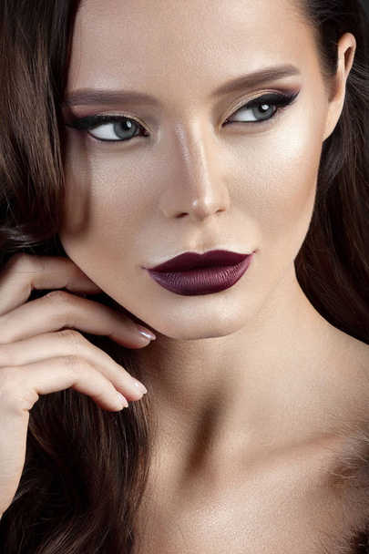 Luxurious young woman with perfect make-up with purple lipstick. Beauty close-up portrait - Photo, image