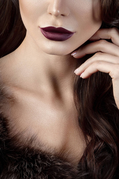 Luxurious young woman with perfect make-up with purple lipstick. Anonymous beauty close-up portrait - Foto, imagen