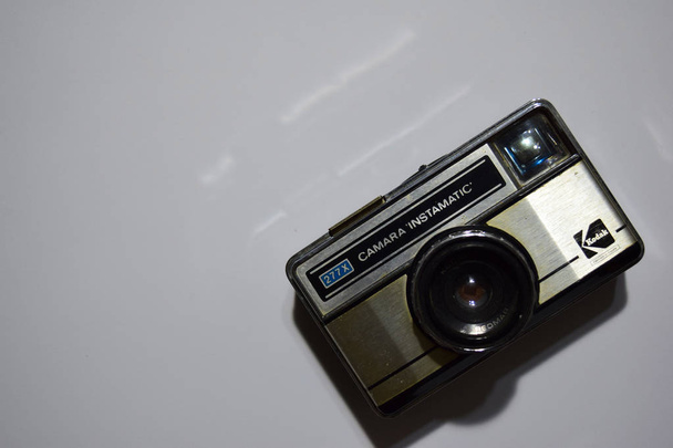 BEKASI, WEST JAVA, INDONESIA. OCTOBER 29, 2018 : Old film camera. White background close-up. Vintage photo - 写真・画像