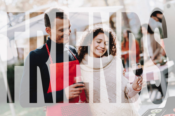 Man And Woman Wine Drinking. Friends Barbecue. Smoked Food. Nature Activity. Outside Relaxing Activity Concept. Smiling People Are Having Fun. Resting Together. Sunny Day. Sweater Weather. - Photo, Image