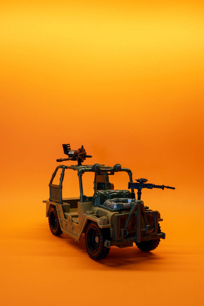 Brown military toy car model with background and copy space - Photo, Image
