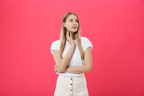 Trendy young female wearing casual clothes posing over pink background - Foto, imagen